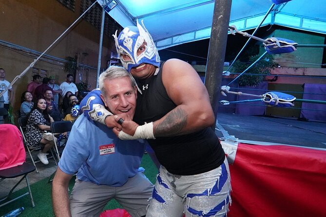 Lucha Libre, Tacos, Margaritas,Tequila and Night Market Tour - Walking through an older downtown park at night